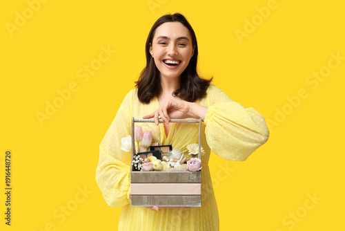 Happy young woman holding E...