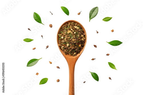 A wooden spoon filled with herbs and spices