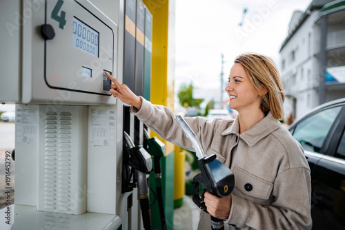 Wallpaper Mural Woman buying gasoline at self-service filling station Torontodigital.ca