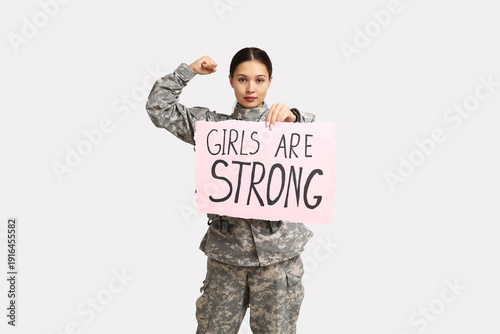 Young female soldier with s...