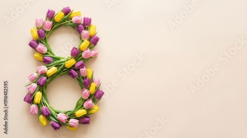 International Womens Day concept with number eight made of colorful tulips on light background.