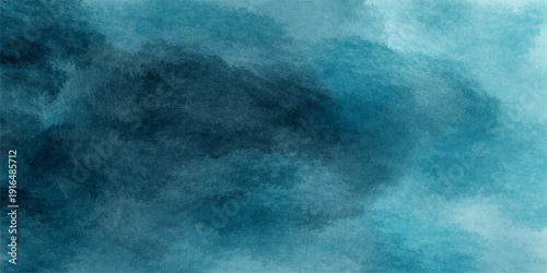 A texture of light and dark blue sky with white clouds over a misty ocean provides an abstract nature background capturing motion and weather