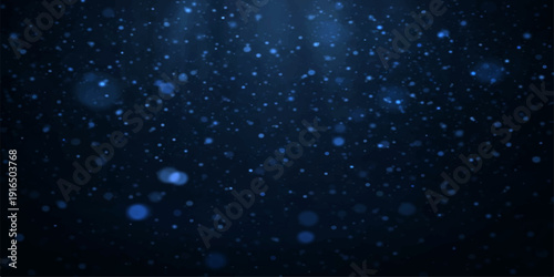 Animated falling snow flakes and glowing blue snowflakes create a festive winter pattern against a dark night sky background with stars and holiday light for a seasonal Christmas motion design