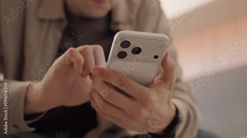 Man using Apple iPhone 17 Pro Max smartphone close up