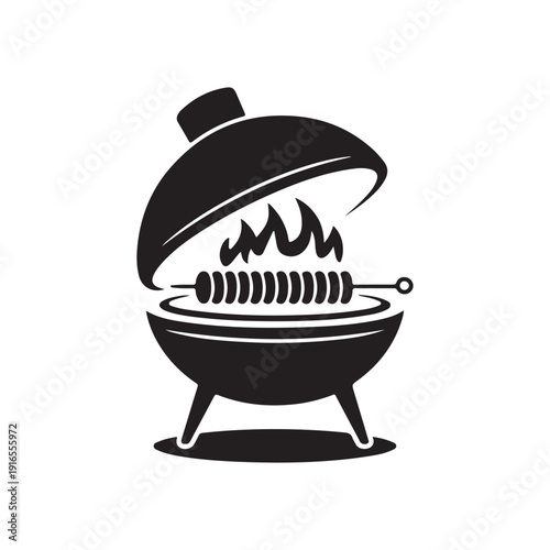 Charcoal barbecue grill with kebab skewers and flame cooking