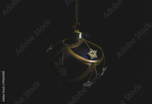 Blue Christmas tree decoration with golden details. 