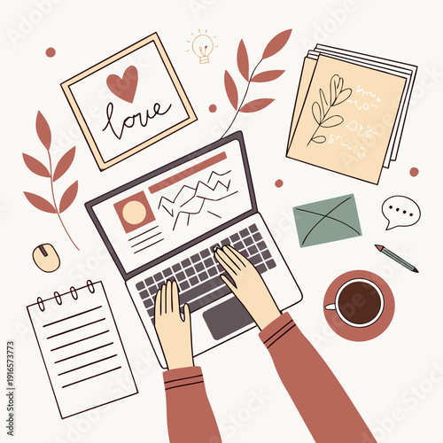 A person working on a laptop with office supplies