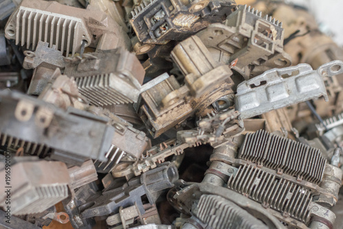 Φωτογραφία Heap of automotive scrap metal including old alternators and starter motors ready for recycling