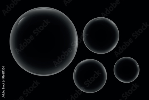 Floating spheres of varying sizes against a dark background