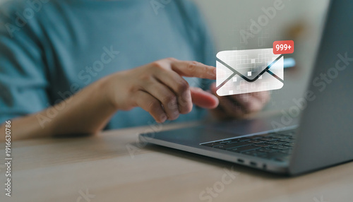 Obraz na plátně User checking email notification on laptop with message and more 999 unread alert, digital communication, inbox management, online marketing and business correspondence