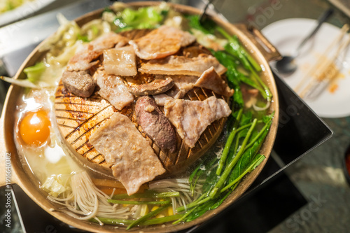 Billede på lærred Traditional Thai barbecue Moo Kata with sliced pork and vegetables on charcoal s