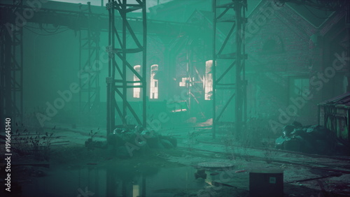 Tableau sur toile Shadows loom over an abandoned industrial site bathed in mist