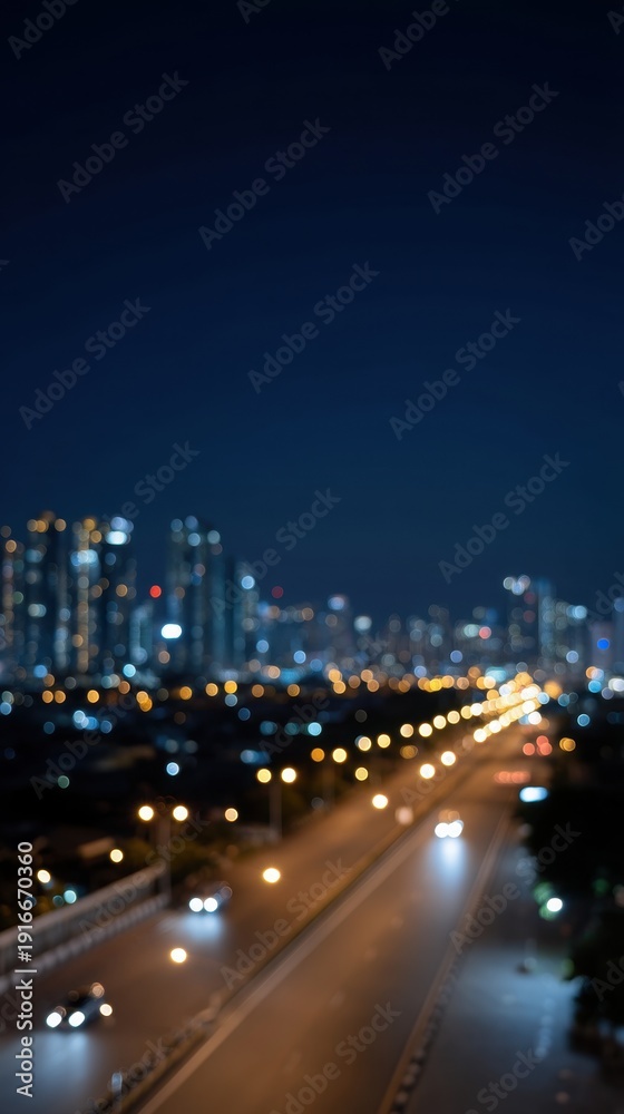 Obraz premium Blurred Bokeh City Lights at Night Creating a Dreamy Urban Atmosphere