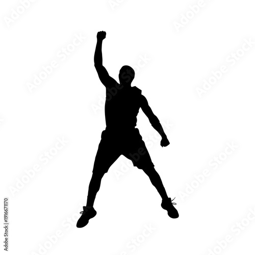 Silhouette of a man celebrating victory with raised arm and clenched fist.