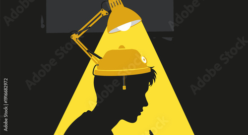 Silhouette of a person under a desk lamp.