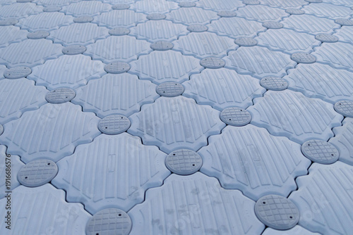Obraz na plátne Floating Jigsaw or floating plastic pontoon walk way floating in the sea