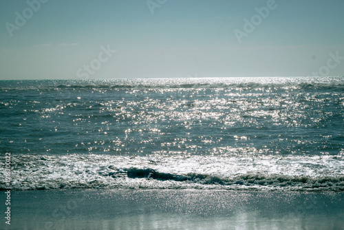 Canvastavla Sunlit Sea Shimmer Over Calm Shore