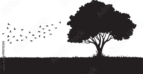 Tree silhouette with birds flying