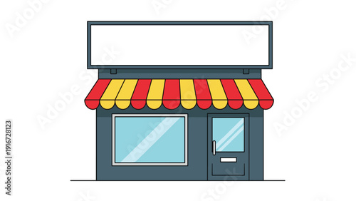 Exterior of a small local shop or grocery store with a blank sign board and a bright red and yellow striped awning.