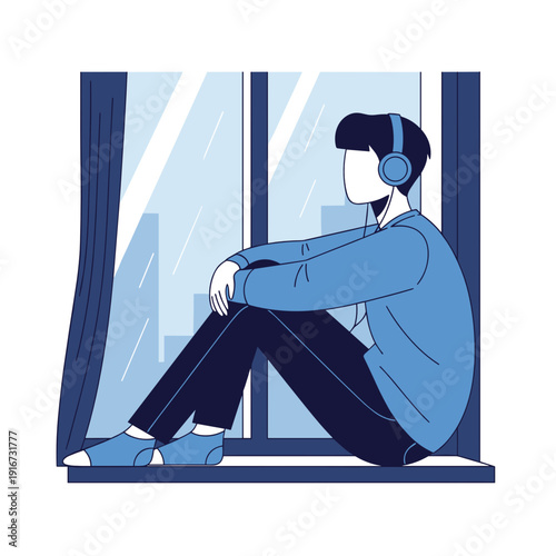 Young man sitting by the window wearing headphones and relaxing  
