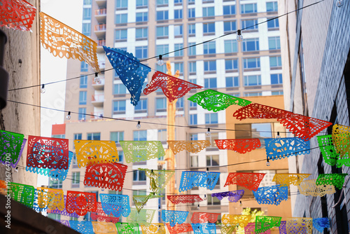 Colorful Papel Picado Decorations in New York Alley