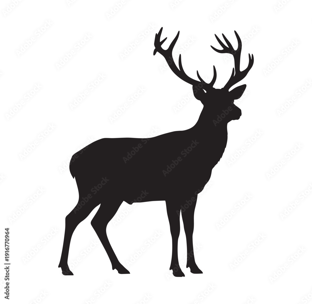 Fototapeta premium black silhouette of a deer with large antlers standing alone