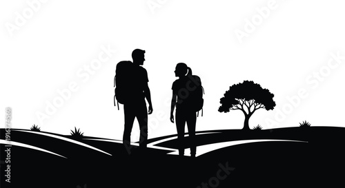 Couple hiking along a path with a scenic view silhouette