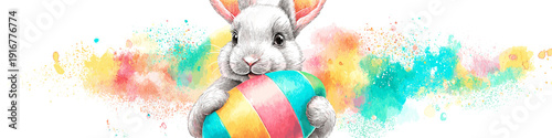 White rabbit holding colorful Easter egg, watercolor splash background. White rabbit holding a brightly striped Easter egg against a vibrant watercolor splash background