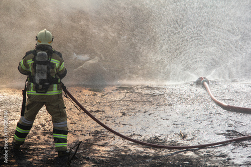 Wallpaper Mural Fire fighting and extinguishing operations with diffuser and water hose Torontodigital.ca