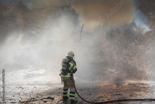 Wallpaper Mural Fire fighting and extinguishing operations with diffuser and water hose Torontodigital.ca