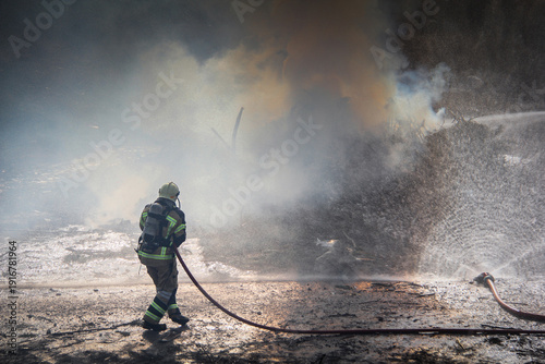 Wallpaper Mural Fire fighting and extinguishing operations with diffuser and water hose Torontodigital.ca