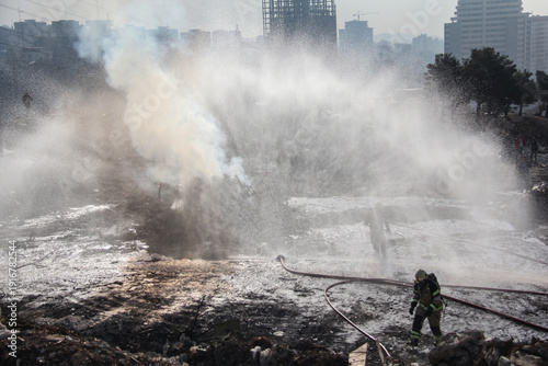 Wallpaper Mural Fire fighting and extinguishing operations with diffuser and water hose Torontodigital.ca