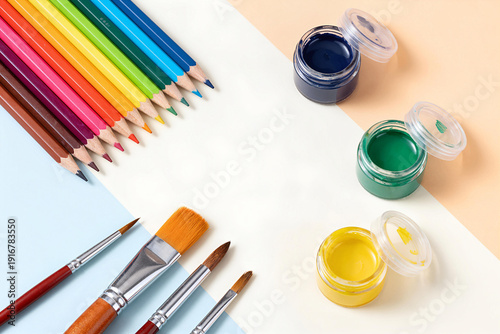 Wallpaper Mural Creative art supplies still life with a row of colorful pencils, paint brushes, and jars of gouache on a tricolor pastel background. Flat lay composition with copy space for inspiration and hobby. Torontodigital.ca