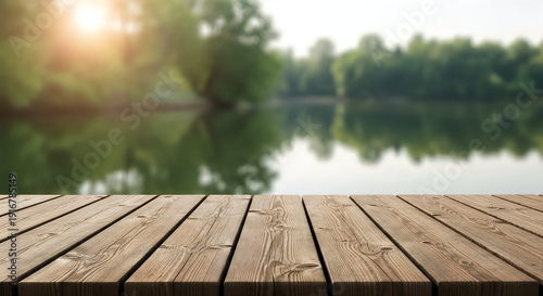 A wooden dock on a lake with trees in the background