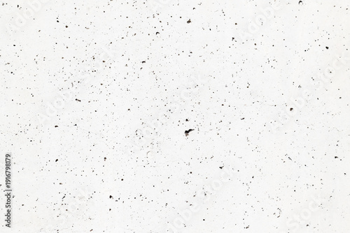 Close-up abstract image of a flat concrete surface showcasing texture, imperf...
