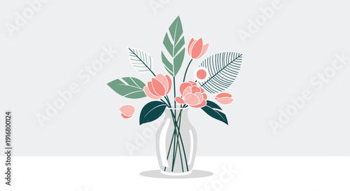 Beautiful floral arrangement with pink and peach flowers and green leaves in a simple clear glass vase on a grey background.