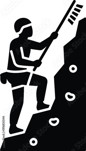 Silhouette Person climbing rock wall with chalk and harness for safety