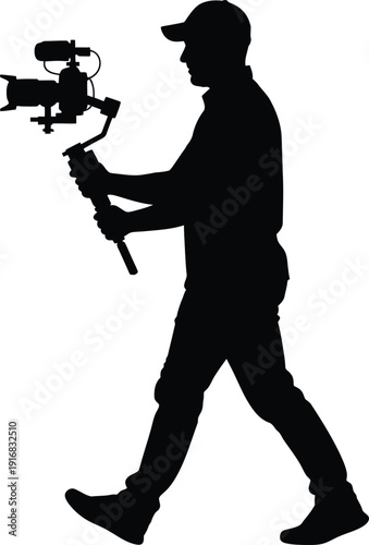 Silhouette Person holding professional video camera while walking outdoors