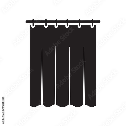 black curtains hanging on a rod