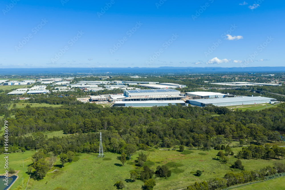 Naklejka premium Drone aerial photograph of buildings in an industrial precinct in the suburb of Eastern Creek in greater Sydney in New South Wales, Australia.