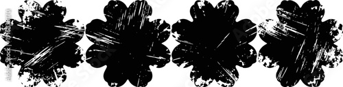 Set of four black grunge circular ink splatters isolated on white background