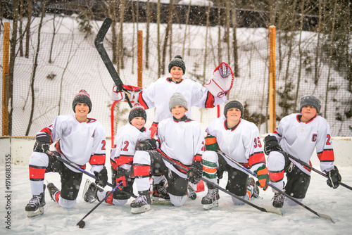 Photography Ice hockey group of teen play hockey outside in winter