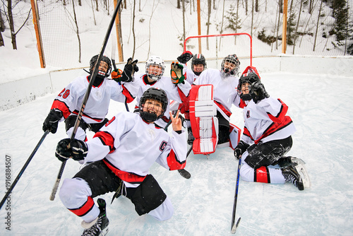 Photography Ice hockey group of teen play hockey outside in winter