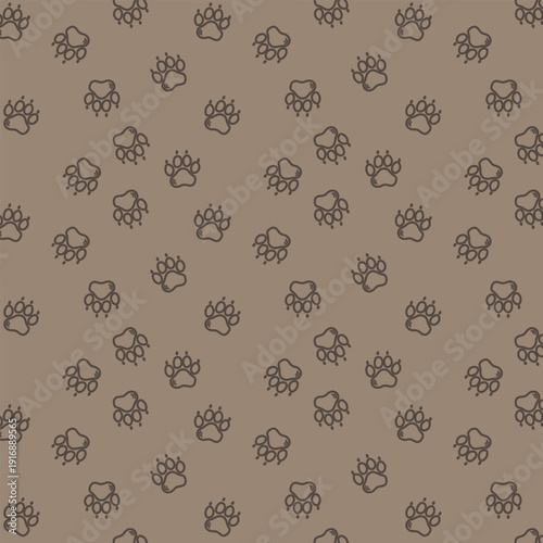 Variety of animal paw prints on brown background