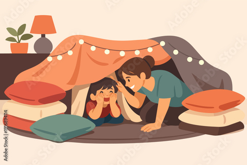 Mother and son playing fort at home, enjoying cozy childhood moments