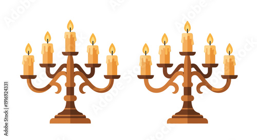 Two ornate candelabras with lit candles isolated on a white background