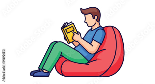 A young man comfortably reads a book while relaxing in a red beanbag chair