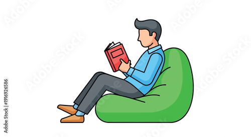 A young man comfortably reading a book while relaxing on a beanbag chair