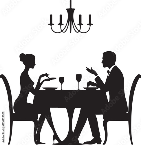 Silhouette couple dining at table with wine glasses under chandelier