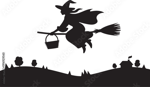 Silhouette of a witch flying on a broomstick over a landscape